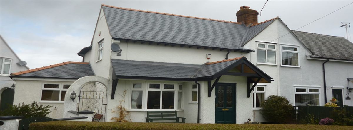 Completed slate re-roof on a semi-detached house at Garden Village, Wrexham